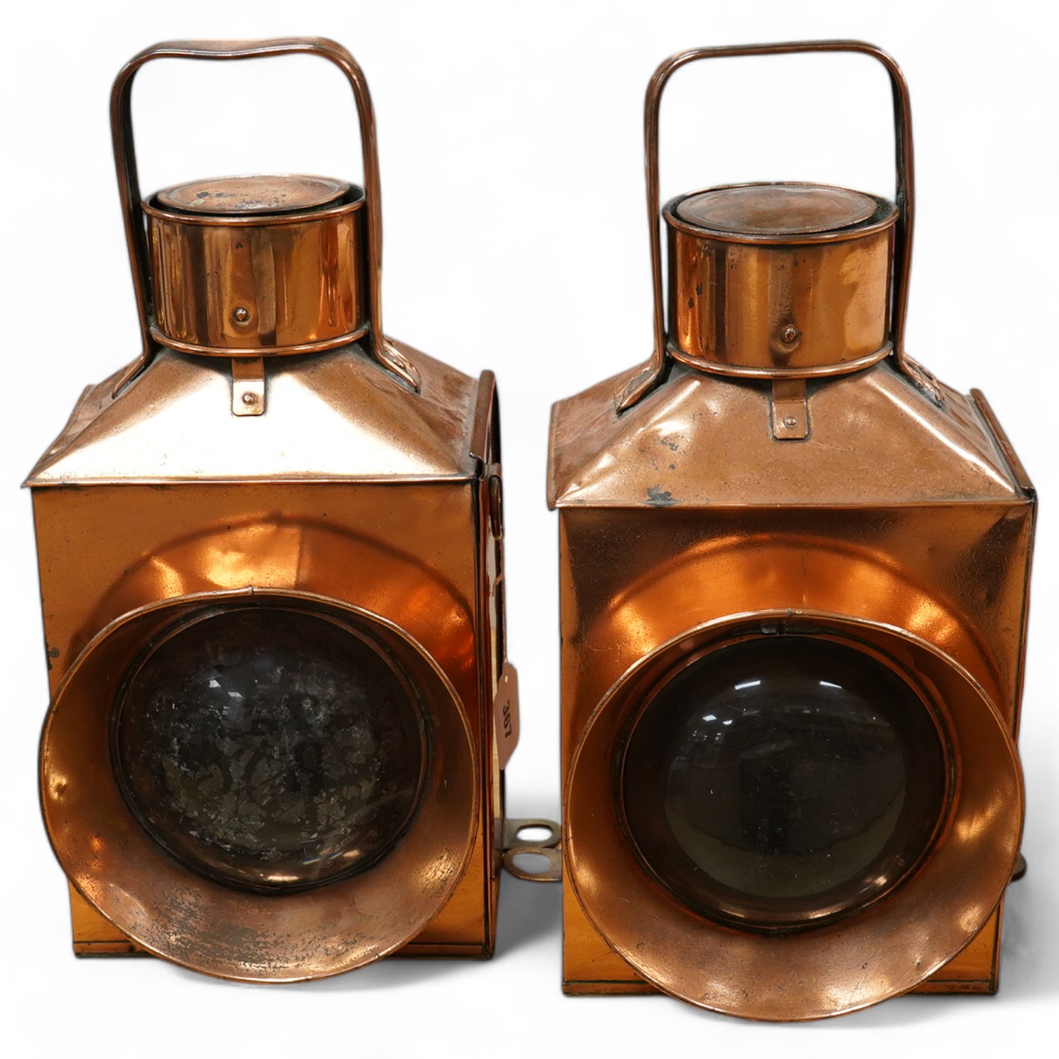 A pair of copper marine or railway oil lamps (missing burners and reservoirs), 44cm high. Condition - fair.